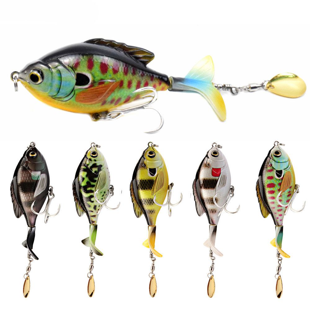 A fish-patterned lure with a blade on its tail above five more patterns