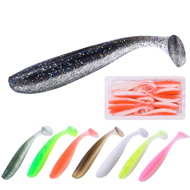 A soft plastic T-tail lure above a pack of orange lures and seven colour options